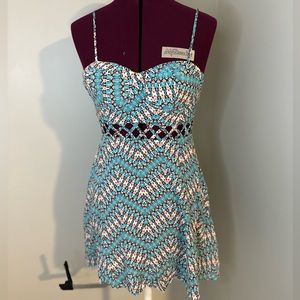 Material girl floral dress with cuts on the waist line